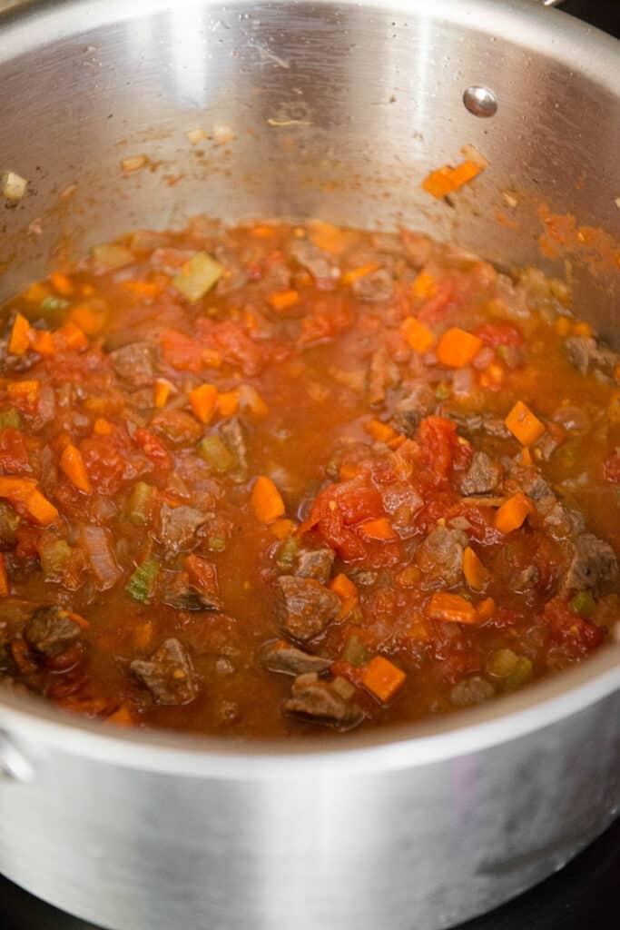 beef and vegetables in pot for soup recipe