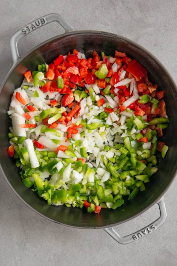 diced onion and bell peppers in pot for vegan chili recipe