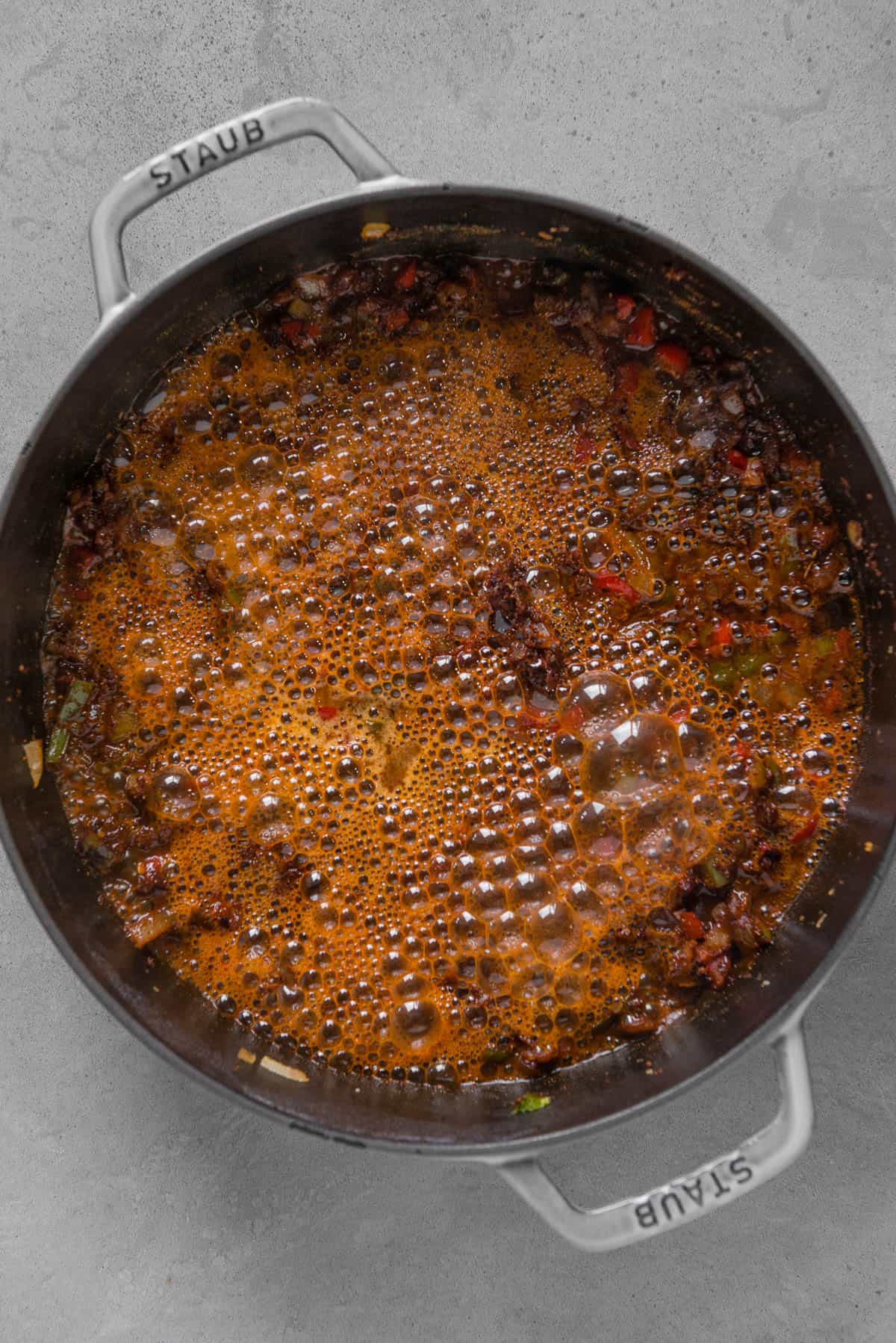 vegetarian chili that is bubbling once beer is added