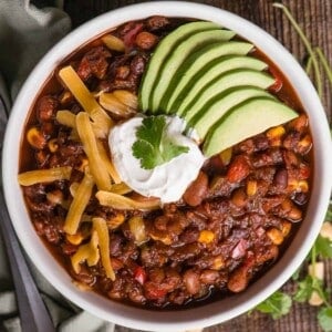bowl of vegetarian chili with toppings