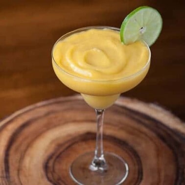 This non-alcoholic kid friendly Virgin Mango Lime Margarita takes only minutes to make and is full of tangy sweet fruit that blends up perfectly smooth.