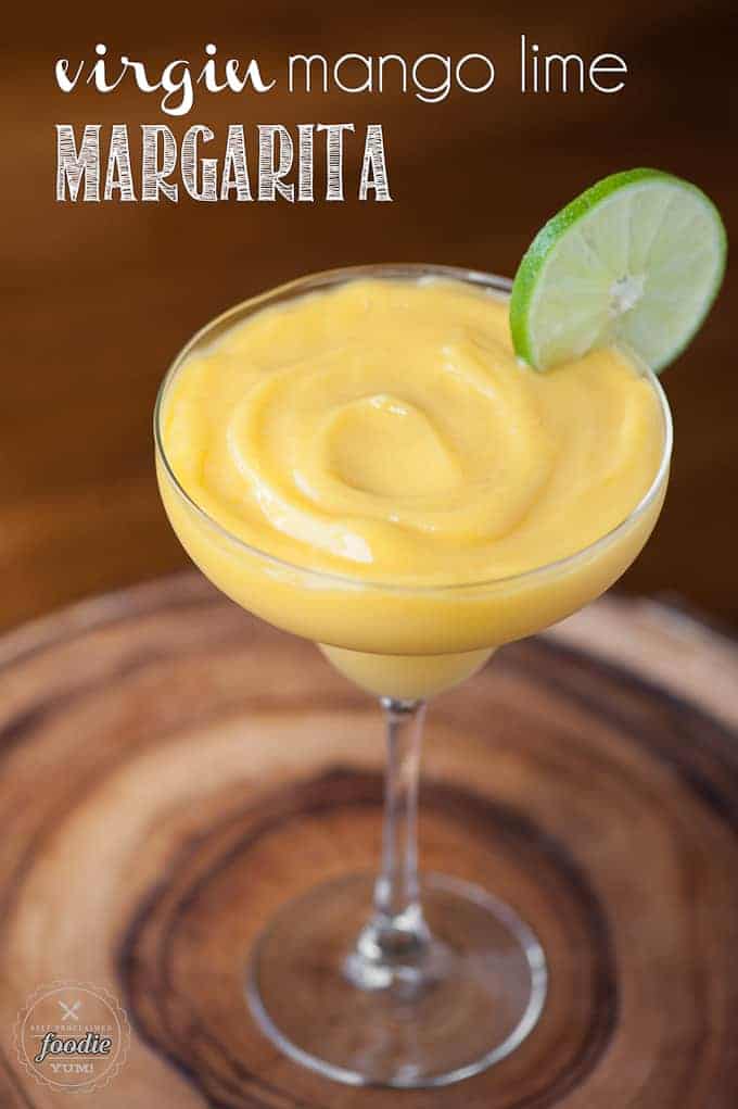 virgin mango margarita in glass with lime