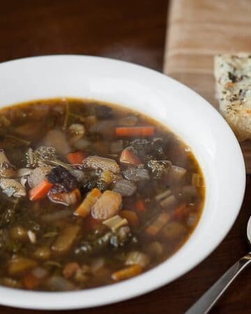 Homemade Winter Minestrone is a healthy and hearty winter soup full of cold weather favorites like kale, squash, beans, bacon, pasta, and savory beef brot